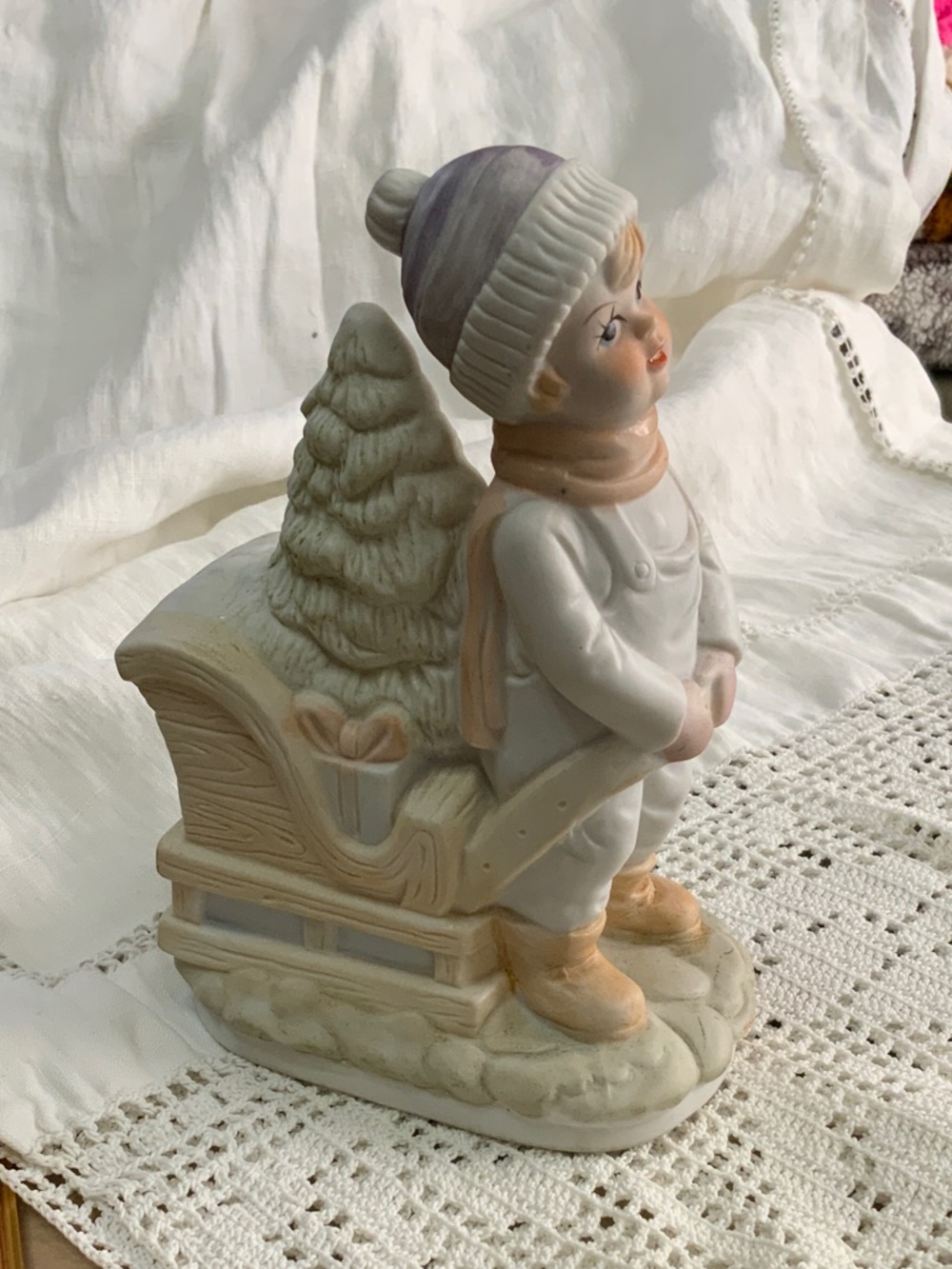 Porcelain Winter Child Figurine with Sled; House of Lloyd